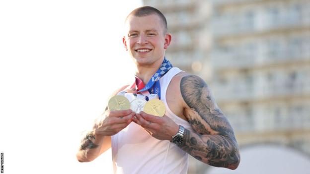 Adam Peaty with his medals from the Tokyo Olympics