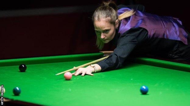 Snooker player Reanne Evans takes a shot