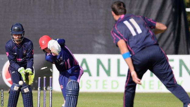 The bails tumble as Nigel Jones takes a wicket for CIYMS in the Belmont play-off