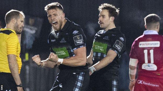 Glasgow's Robbie Nairn and Ruaridh Jackson celebrate victory over Scarlets
