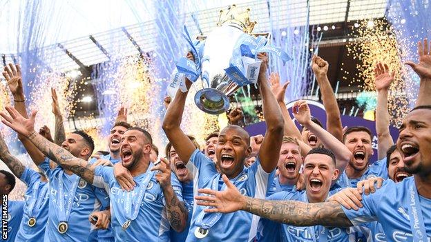 Manchester City celebrate winning Premier League trophy