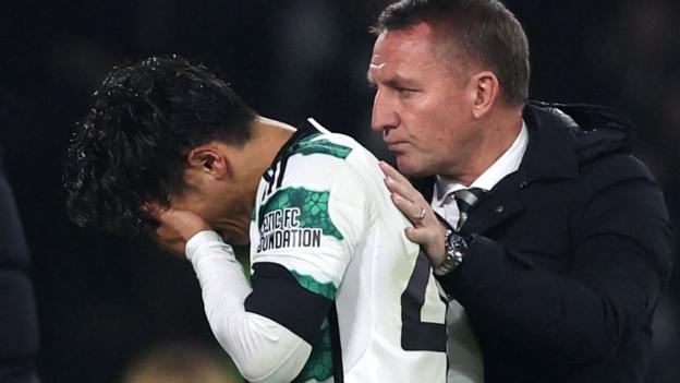 Celtic's Reo Hatate consoled by Brendan Rodgers after leaving the field injured