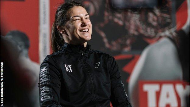 Katie Taylor laughs during an interview