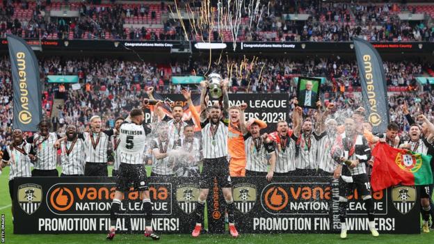 Notts County lift the National League promotion final trophy at Wembley