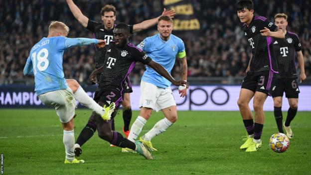 Dayot Upamecano of Bayern Munich fouls Lazio's Gustav Isaksen in the Champions League last-16 first-leg tie