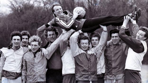 Manager Dave Bassett held aloft by the Wimbledon squad in 1985