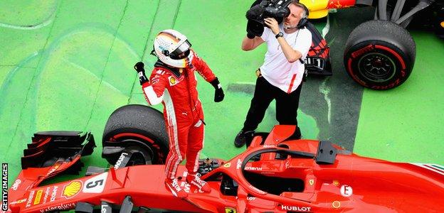 Ferrari F1 driver Sebastian Vettel celebrates winning the 2018 Canadian Grand Prix