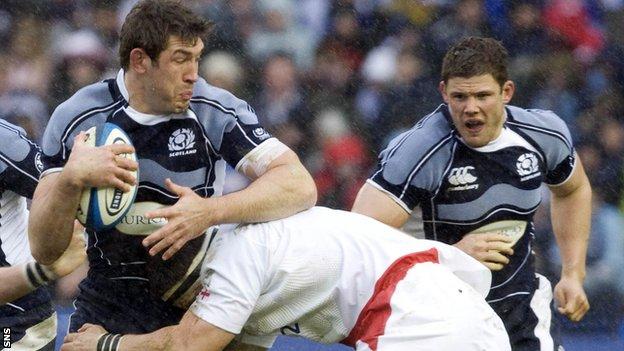 Scotland's Nathan Hines is tackled against England in 2008, as Ross Ford looks on