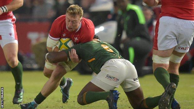 Wales debutant Tommy Reffell is tackled by South Africa captain Siya Kolisi