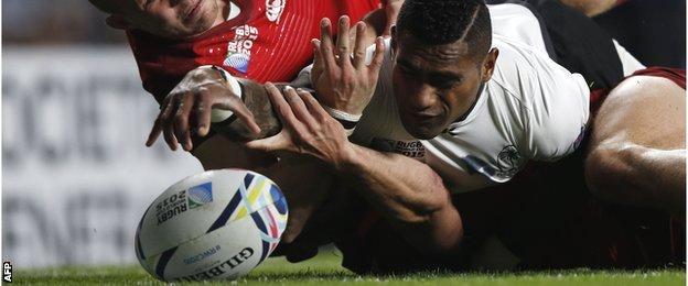 Nikola Matawalu is denied in a double tackle by Mike Brown and Jonny May