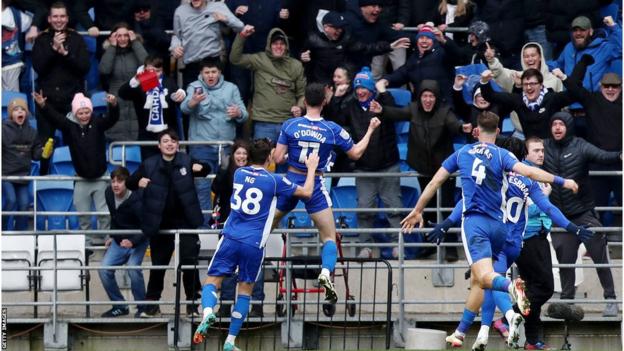 Cardiff players celebrate with Callum O'Dowda