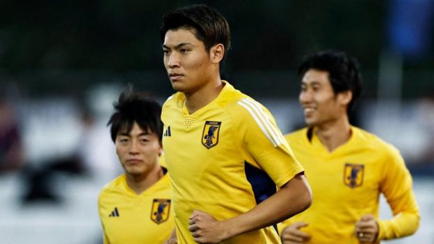 Three men wearing yellow jerseys running