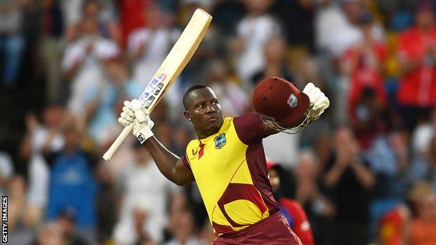 West Indies batter Rovman Powell celebrates hitting a century against England in the third T20