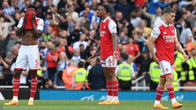 Arsenal players look dejected following their 3-0 loss to Brighton