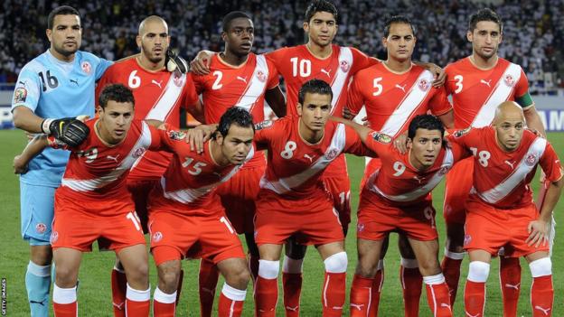 Tunisia players line up before an Africa Cup of Nations game against Zambia in 2010