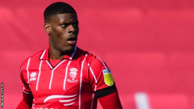 TJ Eyoma: Lincoln City sign defender from Tottenham Hotspur - BBC Sport