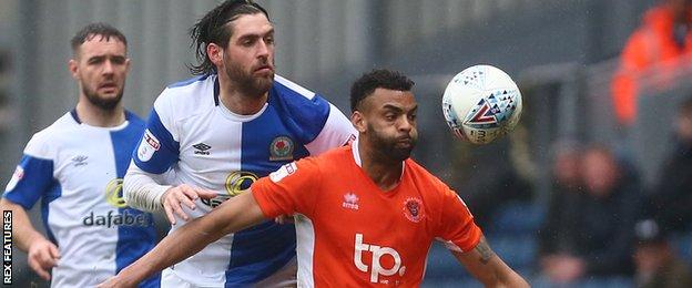 Blackpool defender Curtis Tilt (right)