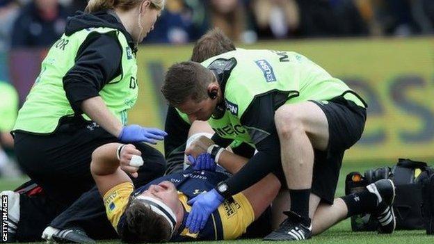 Worcester's Nick Schonert receives treatment for an injury