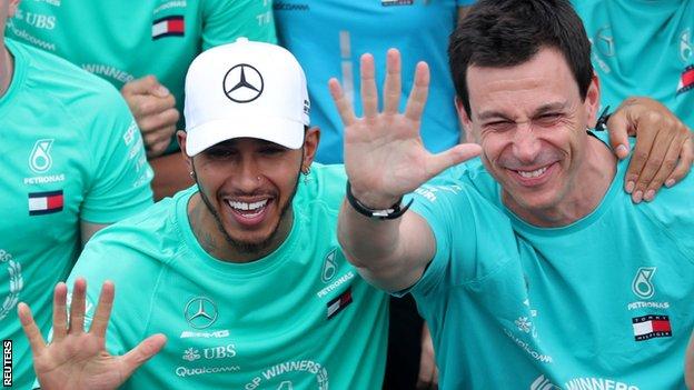 Lewis Hamilton and Toto Wolff celebrate winning the constructors' championship