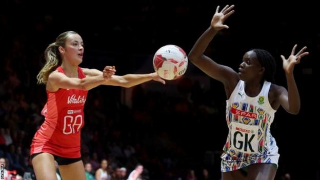 England's Berri Neil passes the ball past South Africa's Phumza Maweni