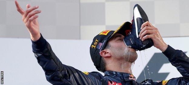 Daniel Ricciardo drinks from his race boot