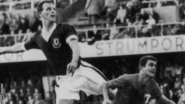 Wales' John Charles (left) rises for a header against Mexico at the 1958 World Cup