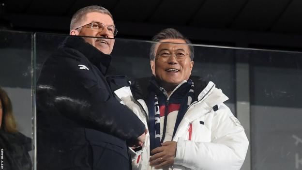South Korea president, Moon Jae-in (right) and Olympic president Thomas Bach greet the stadium