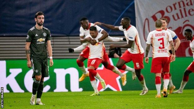 Bruno Fernandes (left) reacts as RB Leipzig celebrate