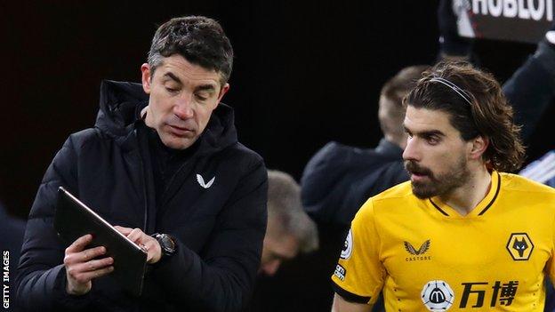 Wolves manager Bruno Lage (left) and midfielder Ruben Neves