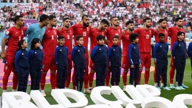 The Iran players lining up for the national anthem