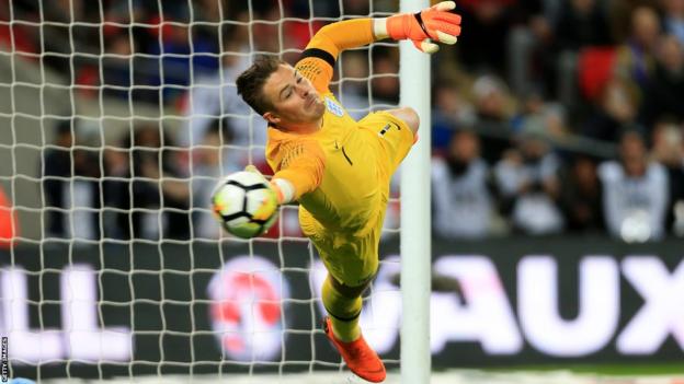 Jack Butland is beaten by a penalty while playing for England against Italy