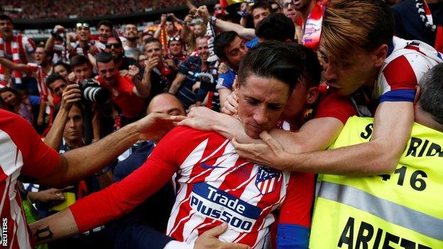 Fernando Torres celebrates his second goal with Atletico Madrid fans