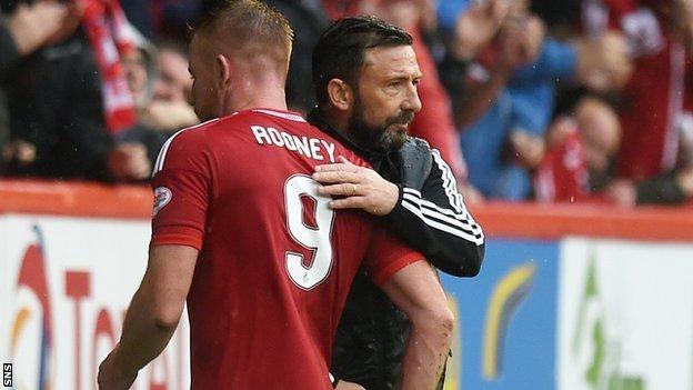 Aberdeen boss Derek McInnes congratulates Adam Rooney