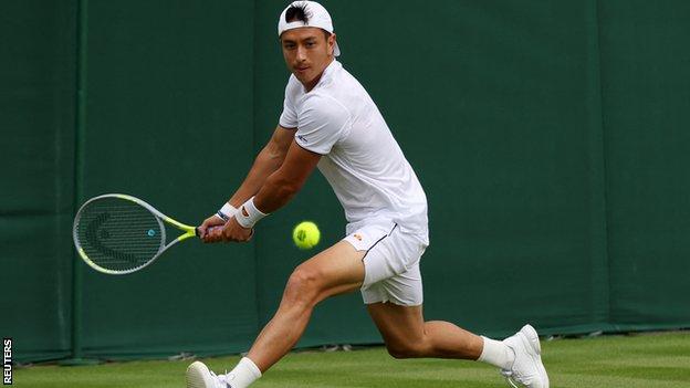 Ryan Peniston prepares to play a backhand during his Wimbledon first-round win v Henri Laaksonen