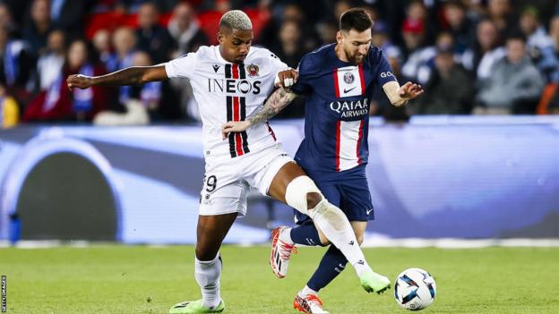 Mario Lemina competes with Paris St-Germain's Lionel Messi during a game in France