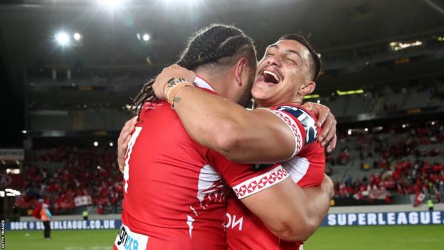 Tonga players celebrate after beating Australia in 2019