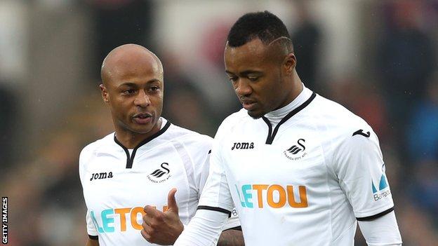 Andre Ayew (left) and his brother Jordan playing for Swansea City