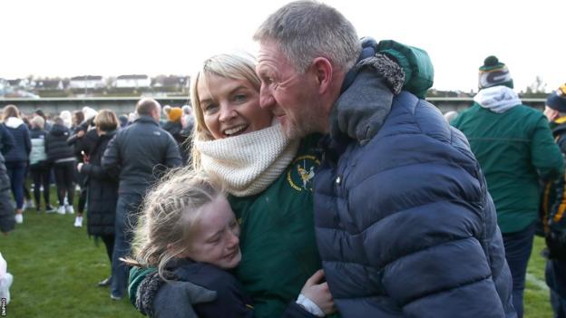 Dunloy manager Gregory O'Kane celebrates with his family after his team's recent Ulster Club Final triumph over Slaughtneil