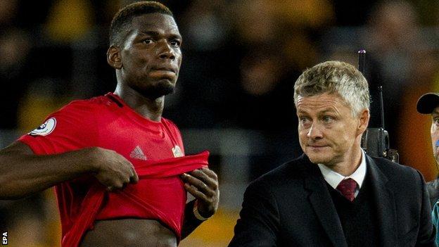 Paul Pogba (left) and Manchester United manager Ole Gunnar Solksjaer
