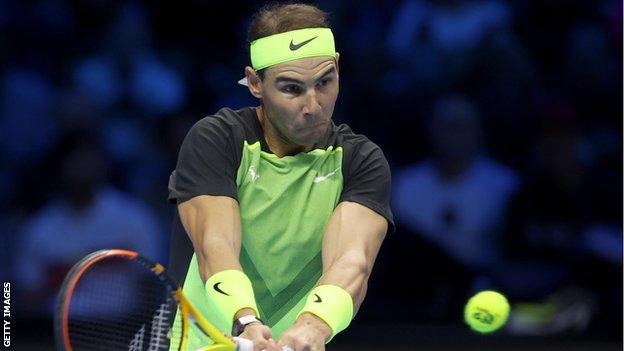 Rafael Nadal hits a return against Taylor Fritz at the ATP Finals in Turin
