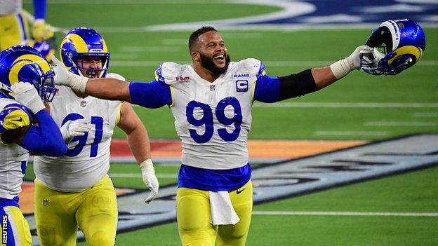 Rams' Aaron Donald not about to let go of Super Bowl trophy