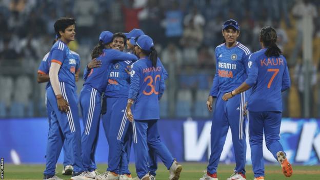 India celebrate taking a wicket