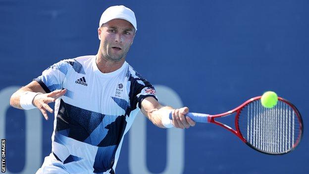 Liam Broady plays a forehand shot during a match at the 2020 Tokyo Olympics