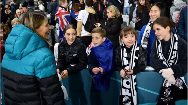 New Zealand coach Jitka Klimkova talks to young fans of the Football Ferns during the 2023 Women's World Cup