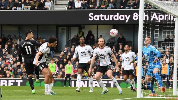 Gabriel Martinelli (left) scores Arsenal's second goal against Fulham