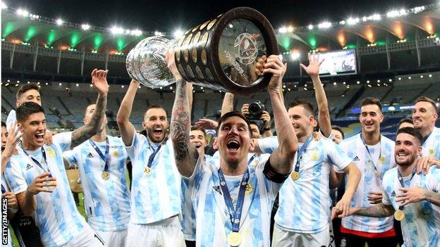 Lionel Messi hoists aloft the Copa America