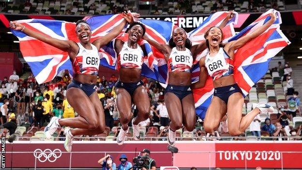 Asha Philip, Imani Lansiquot, Dina Asher-Smith and Daryll Neita of Team GB celebrate winning the bronze medal in the Women's 4x100m relay final