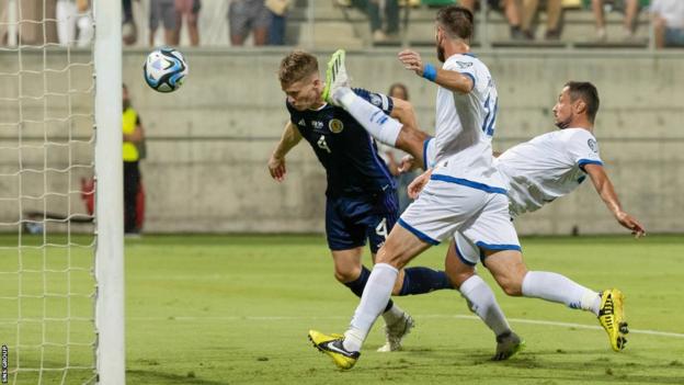 Scotland's Scott McTominay scores to make it 1-0 during a UEFA Euro 2024 qualifier between Cyprus and Scotland at the AEK Arena