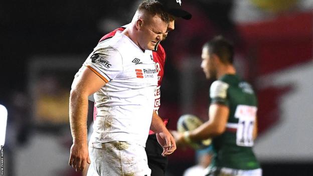 Dewi Lake is in discomfort as he leaves the field
