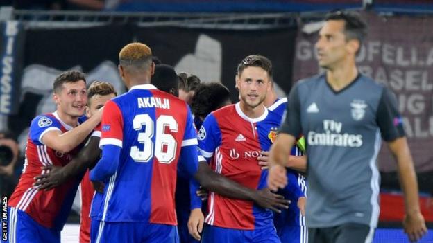 Basel's players celebrate a goal against Benfica